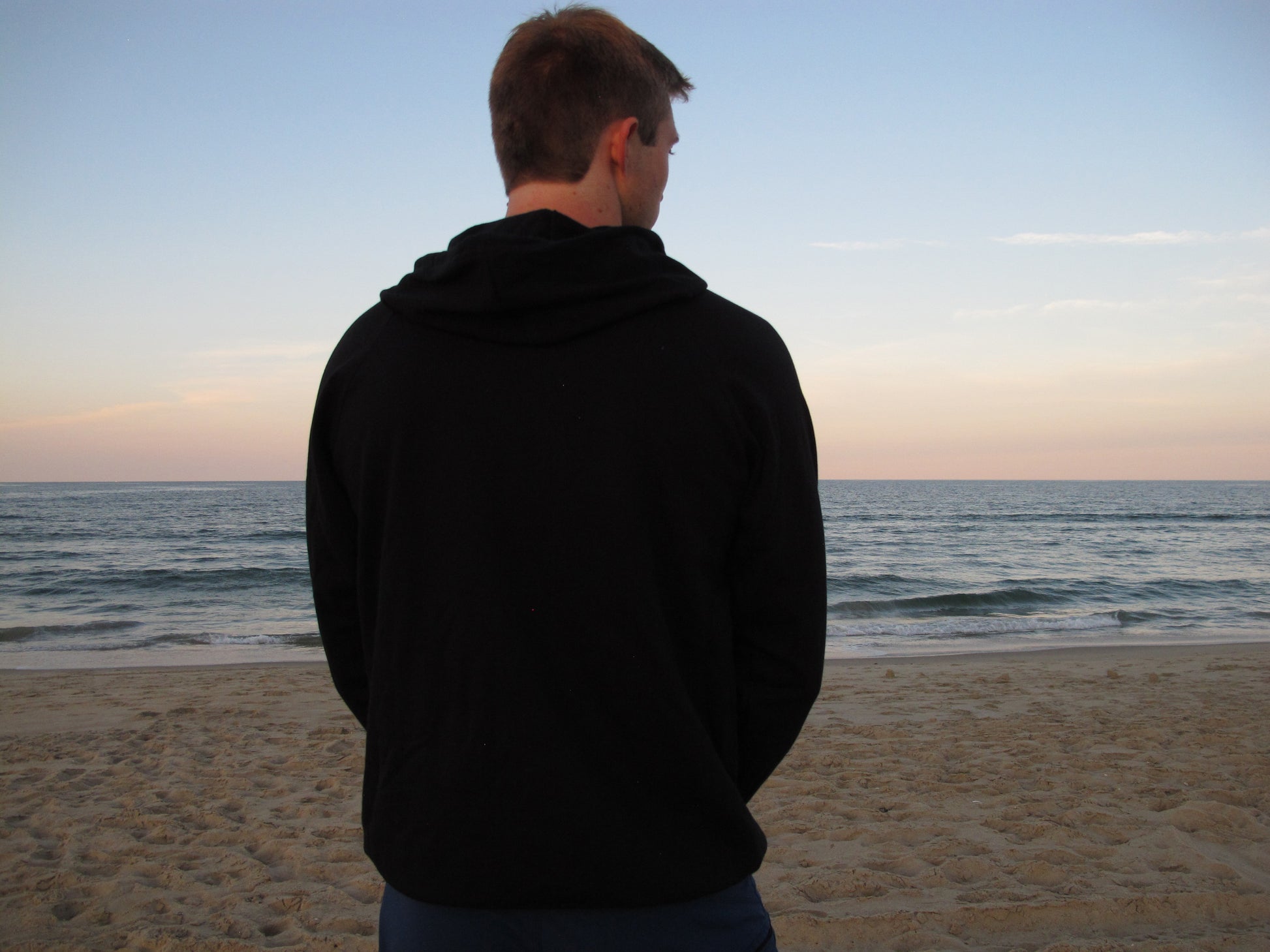 Breath black hoodie, crafted in the USA from organic cotton. Soft, sustainable, and ideal for layering in style.