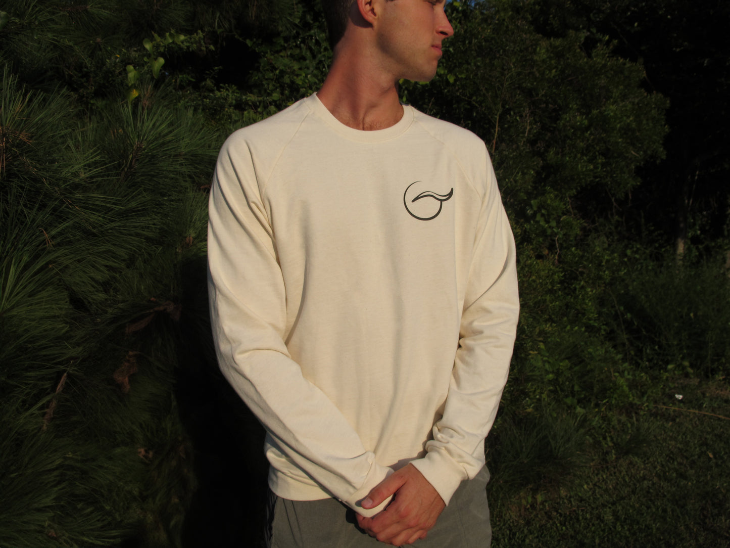 Breath tan crewneck sweater, perfect for layering. Made with 100% organic cotton, this ethically crafted, USA-made piece combines comfort and sustainability.