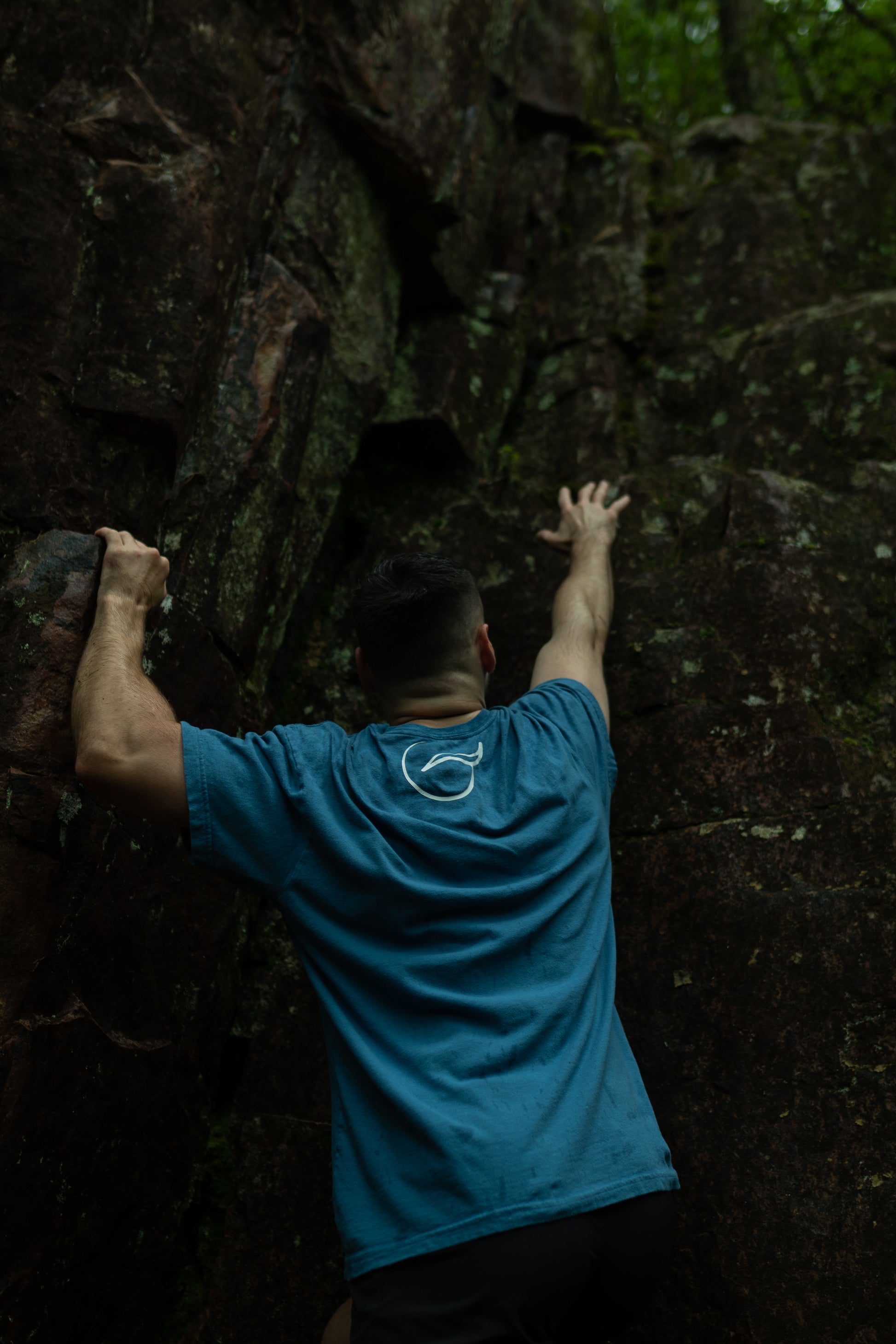 Back of light blue t shirt made from 100% Organic Cotton displaying the Breath brand name across the front with the logo on the back.