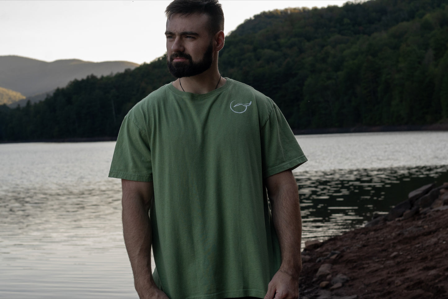 Light Mint Green T Shirt, front with logo on chest brand name Breath on the back.