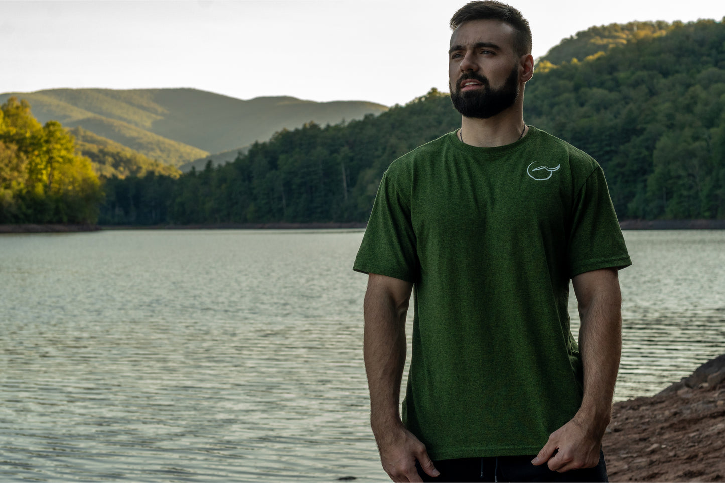 Green 50 50 up-cycled cotton and recycled polyester short sleeve t shirt front with the logo on the left chest.