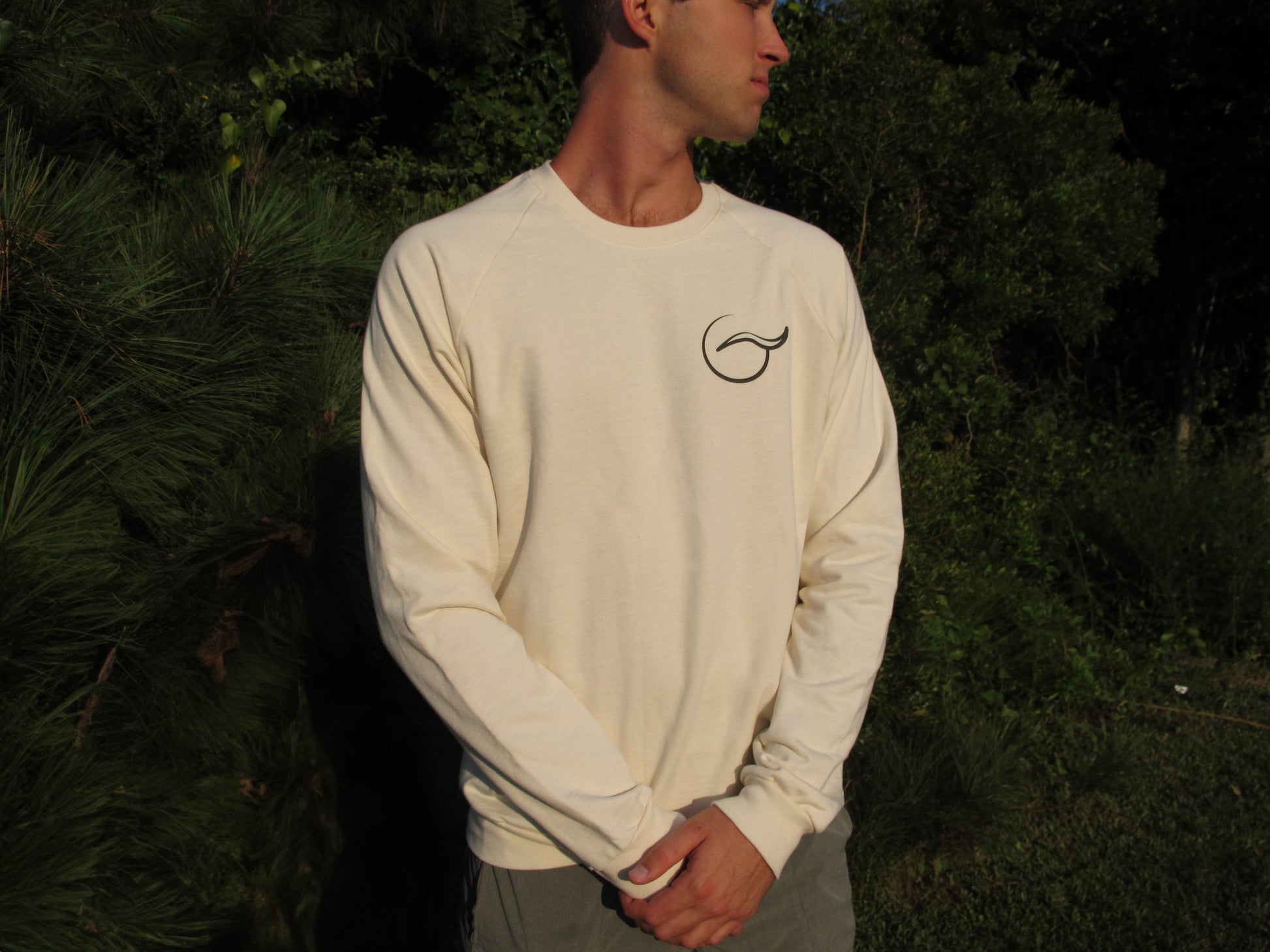 Breath tan crewneck sweater, perfect for layering. Made with 100% organic cotton, this ethically crafted, USA-made piece combines comfort and sustainability.
