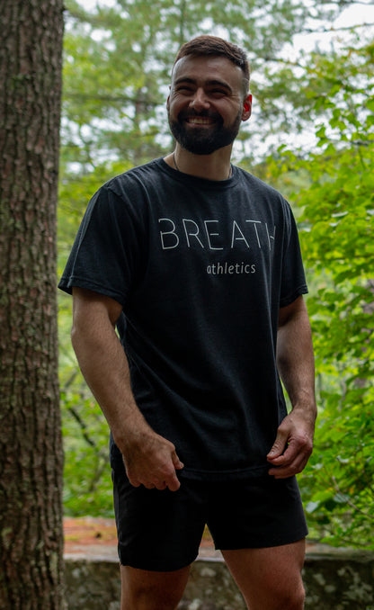 The Front of the Breath Black 50/50 Cotton Recycled Polyester Blended Short Sleeve T shirt with the word Breath Across the Front.