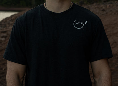 chest view of the Organic cotton black t shirt with short sleeves with the logo on the left chest.