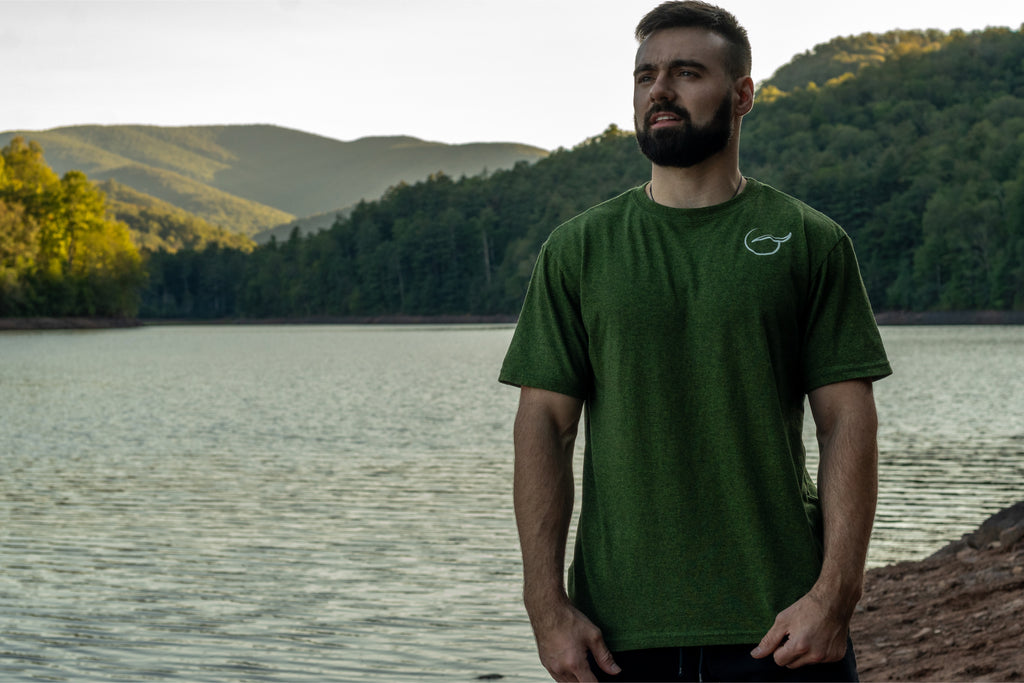Green 50 50 up-cycled cotton and recycled polyester short sleeve t shirt front with the logo on the left chest.